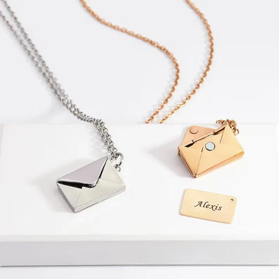 Stainless steel secret love message envelope pendant necklace for women in gold, silver, and rose gold.