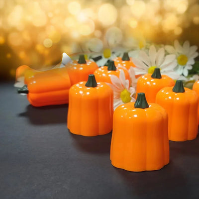 LED pumpkin shaped tealight candles, flameless flickering, Halloween decoration.